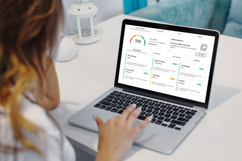 Member viewing her credit score and report on a laptop